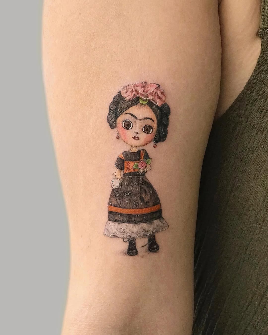 Whimsical Frida Kahlo Tattoo with Floral Accents Tattoo Design