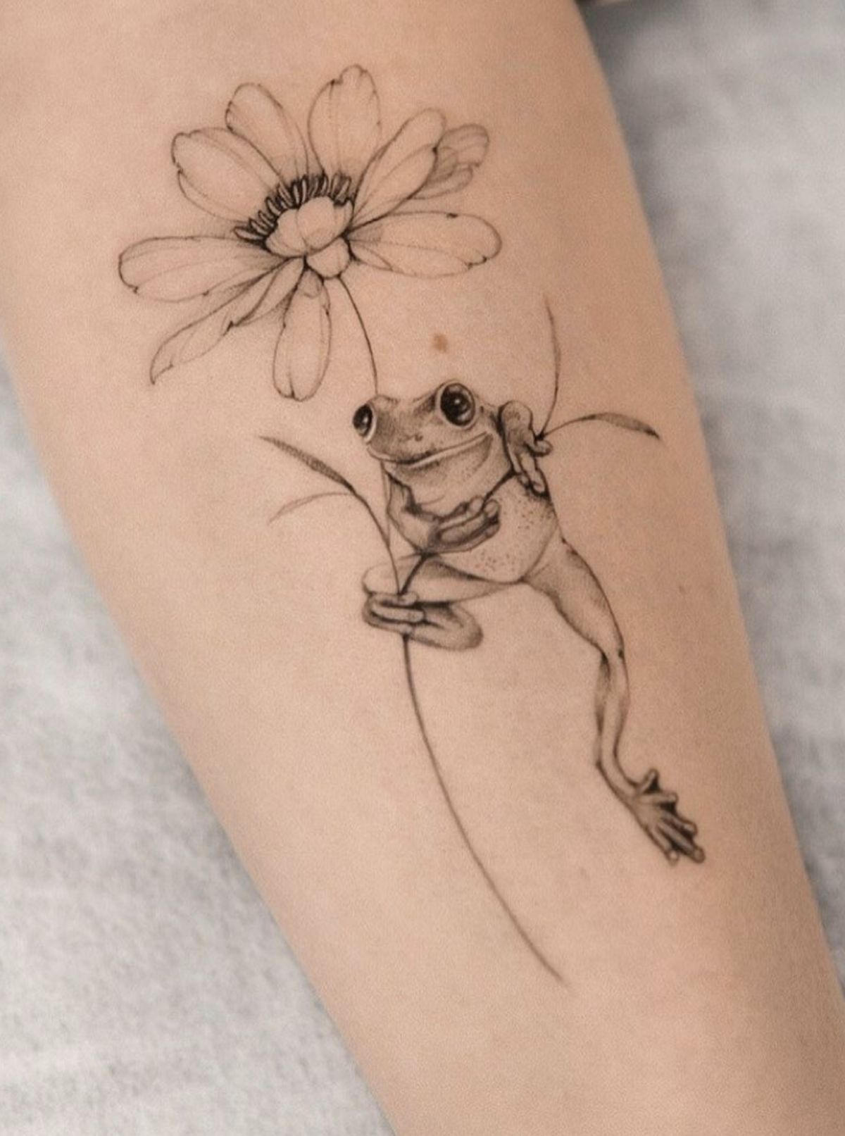 Frog Holding a Daisy Tattoo Tattoo Design