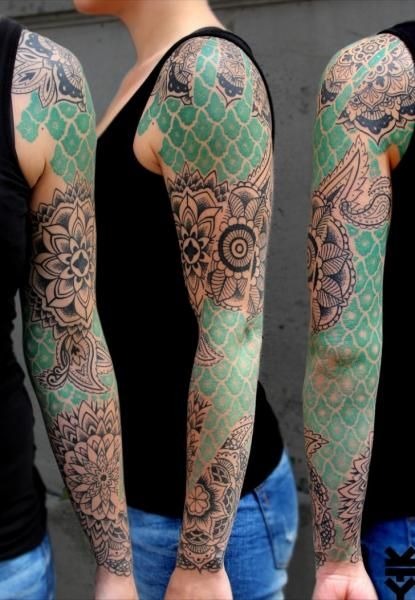 For those who love symmetry and order, this floral full sleeve tattoo color design combines geometric patterns with intricate floral elements.