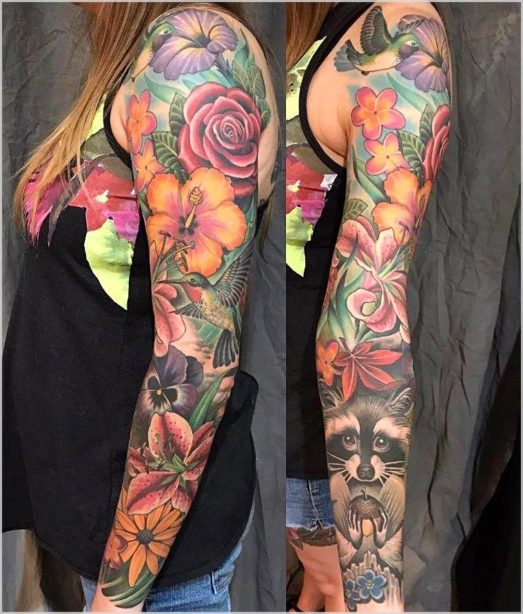 A explosion of nature's beauty, this sleeve is a riot of colors featuring an array of flowers, birds, and a curious raccoon.