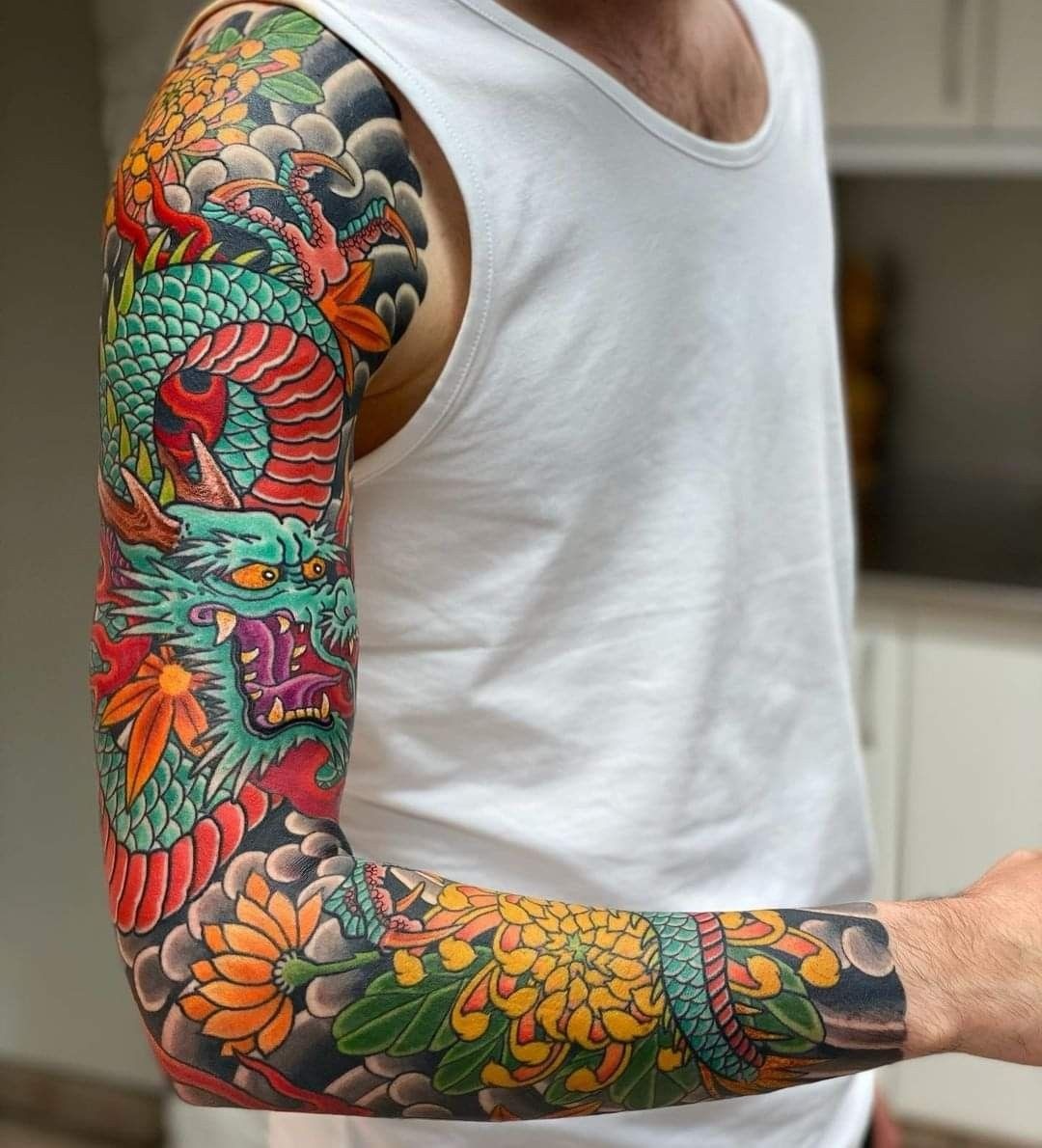 Colorful Japanese Dragon and Chrysanthemum Sleeve Tattoo Design