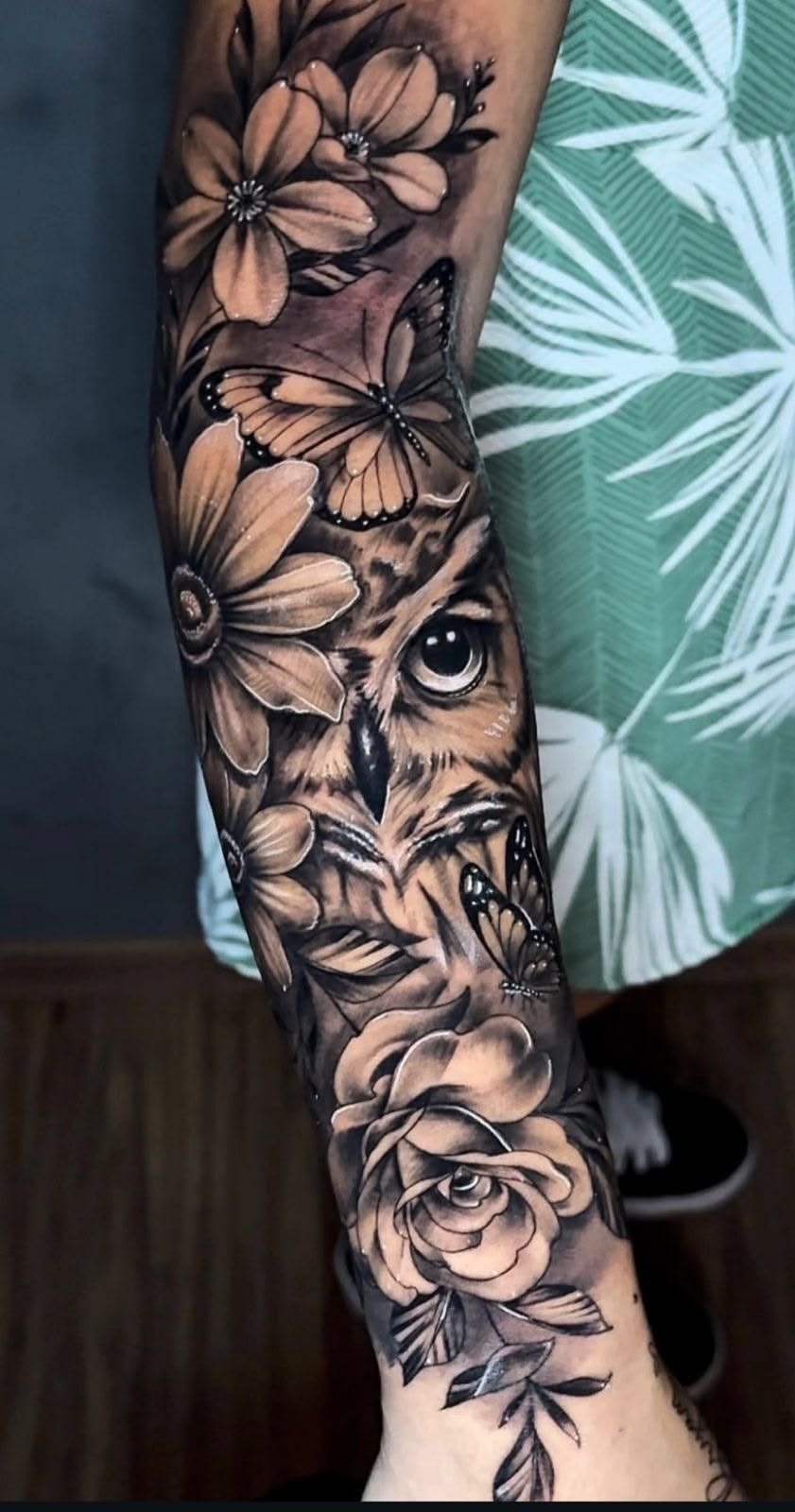 Owl, Butterfly, and Flower Realism Sleeve Tattoo Design