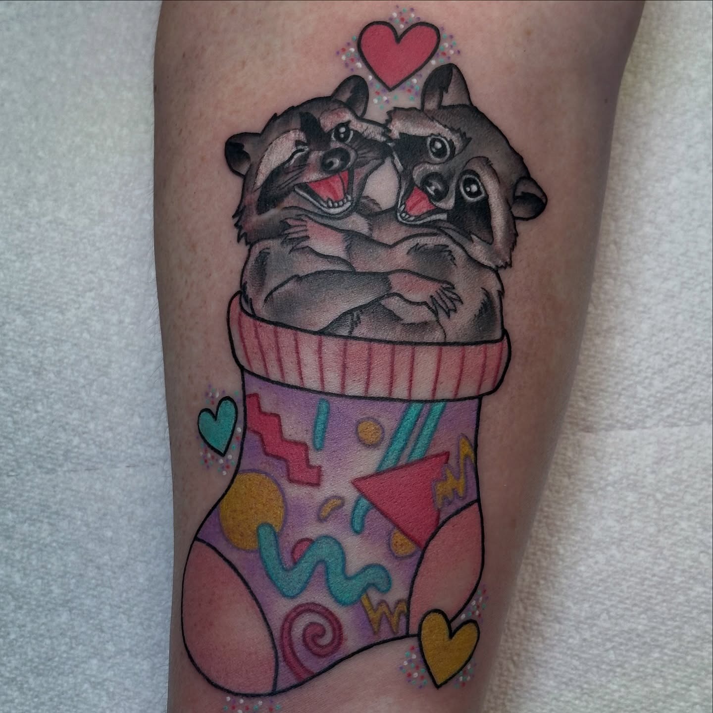 Raccoons in a Cozy Sock Tattoo Tattoo Design