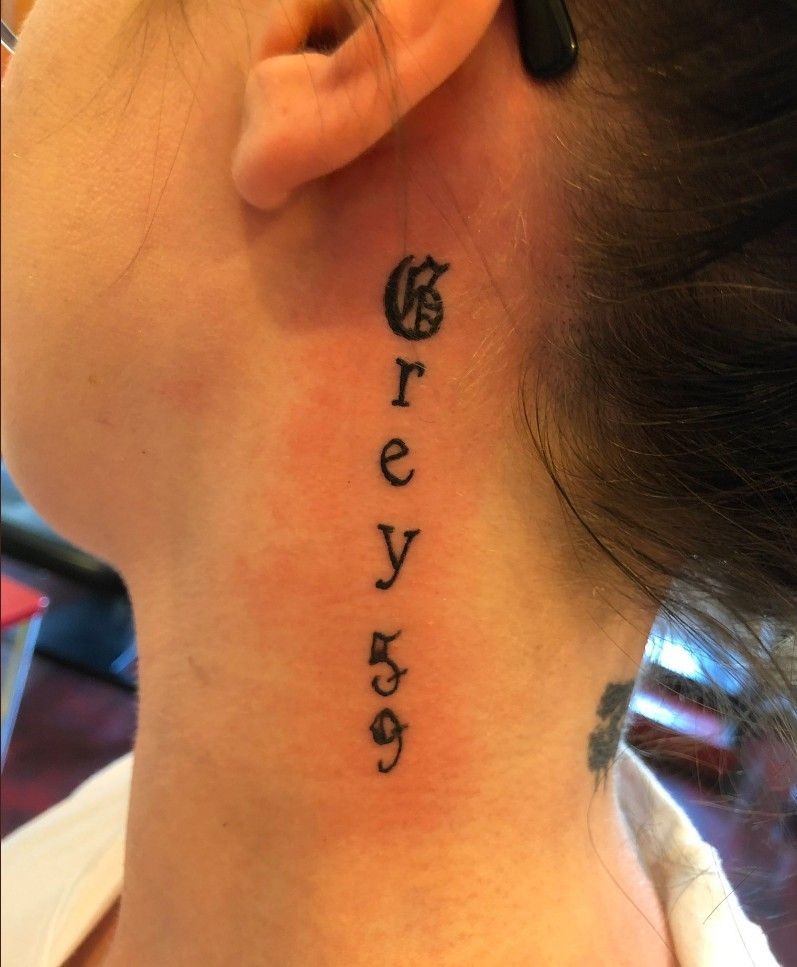 Grey 59 Script Behind the Ear Tattoo Design