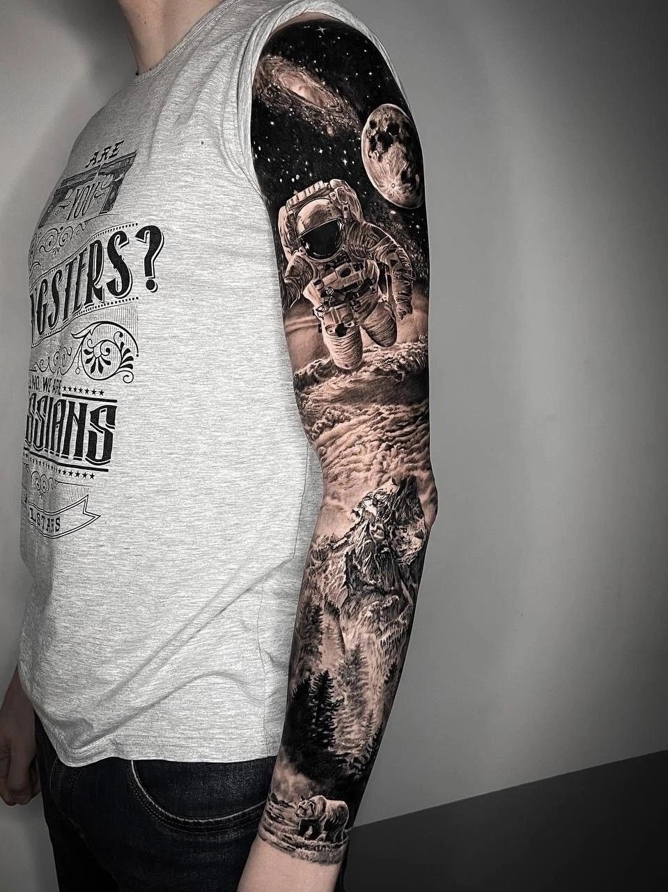 Black and Grey Astronaut Sleeve, a tattoo design rendered in clean detailed linework for the wrist.