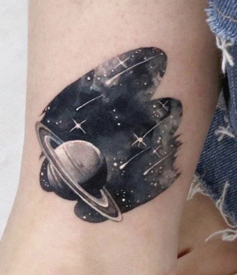 Minimal Saturn and Starfield Tattoo, a tattoo design rendered in clean detailed linework for the arm.
