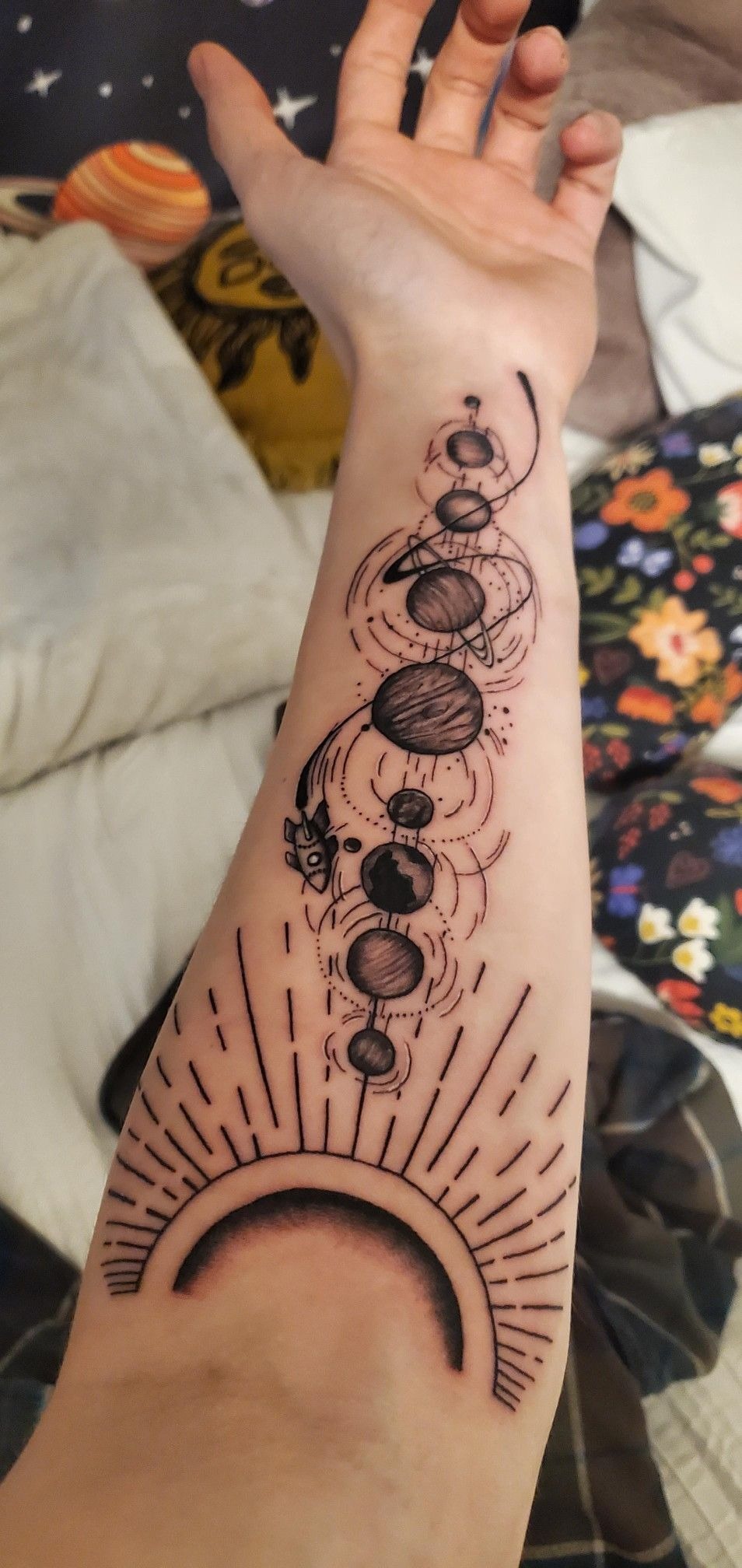 Solar System Linework Forearm Tattoo, a tattoo design rendered in sketch-style for the hand.