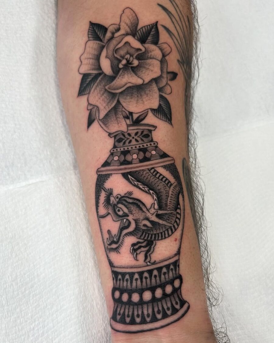 Intricate gardenia tattoo with dragon motif Tattoo Design