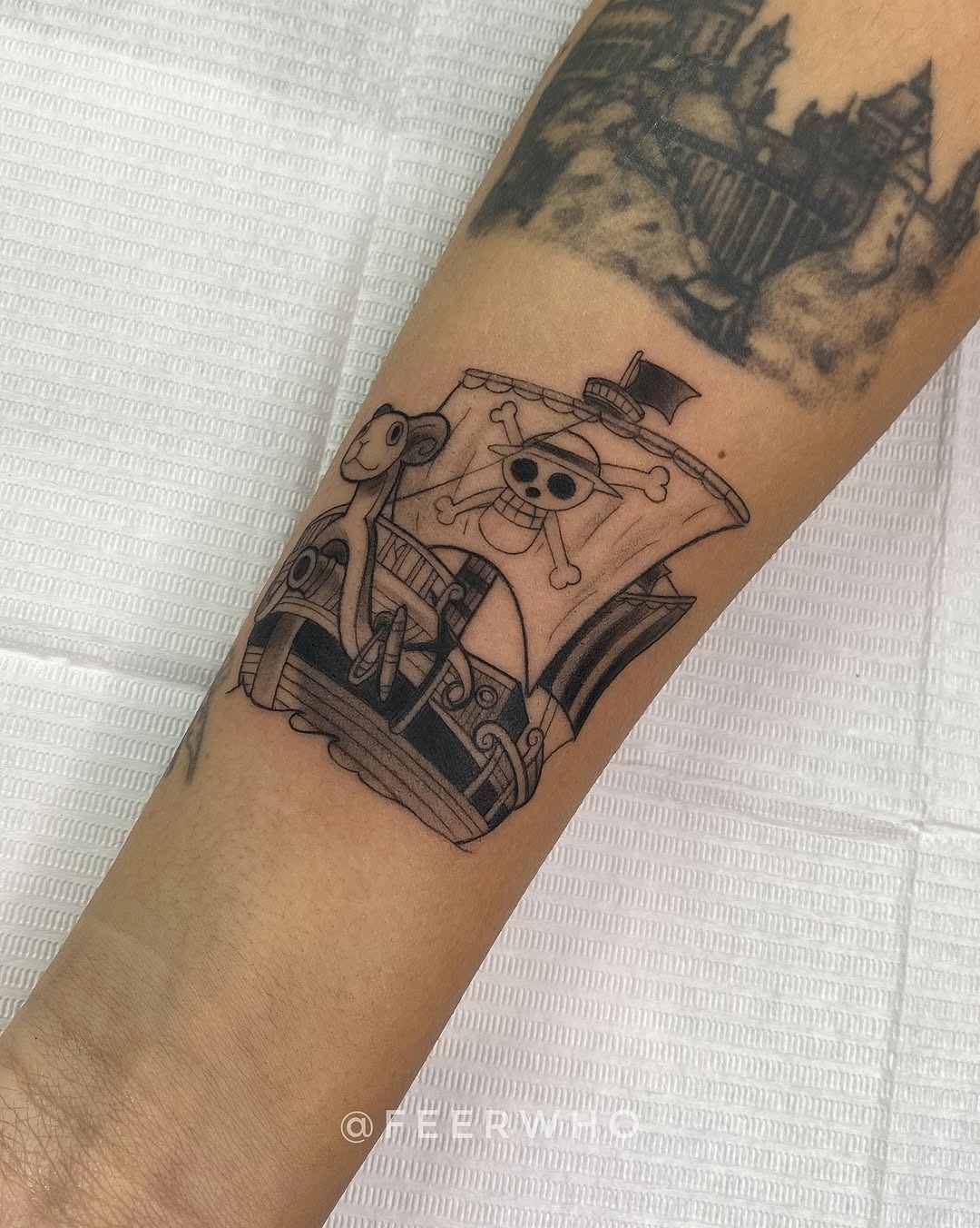 Unique squid tattoo featuring a pirate ship Tattoo Design