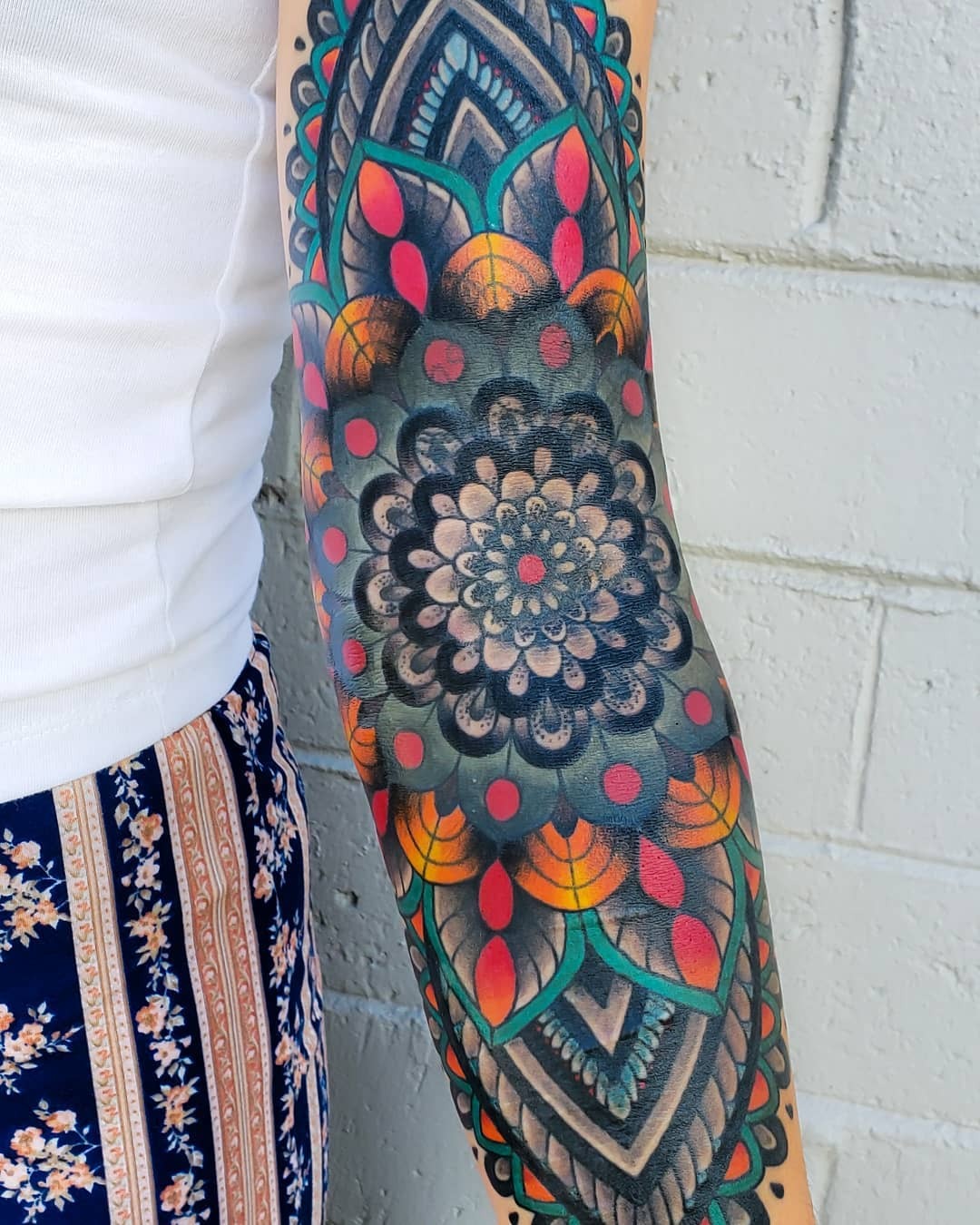 Colorful Mandala Tattoo Adorning the Arm Tattoo Design