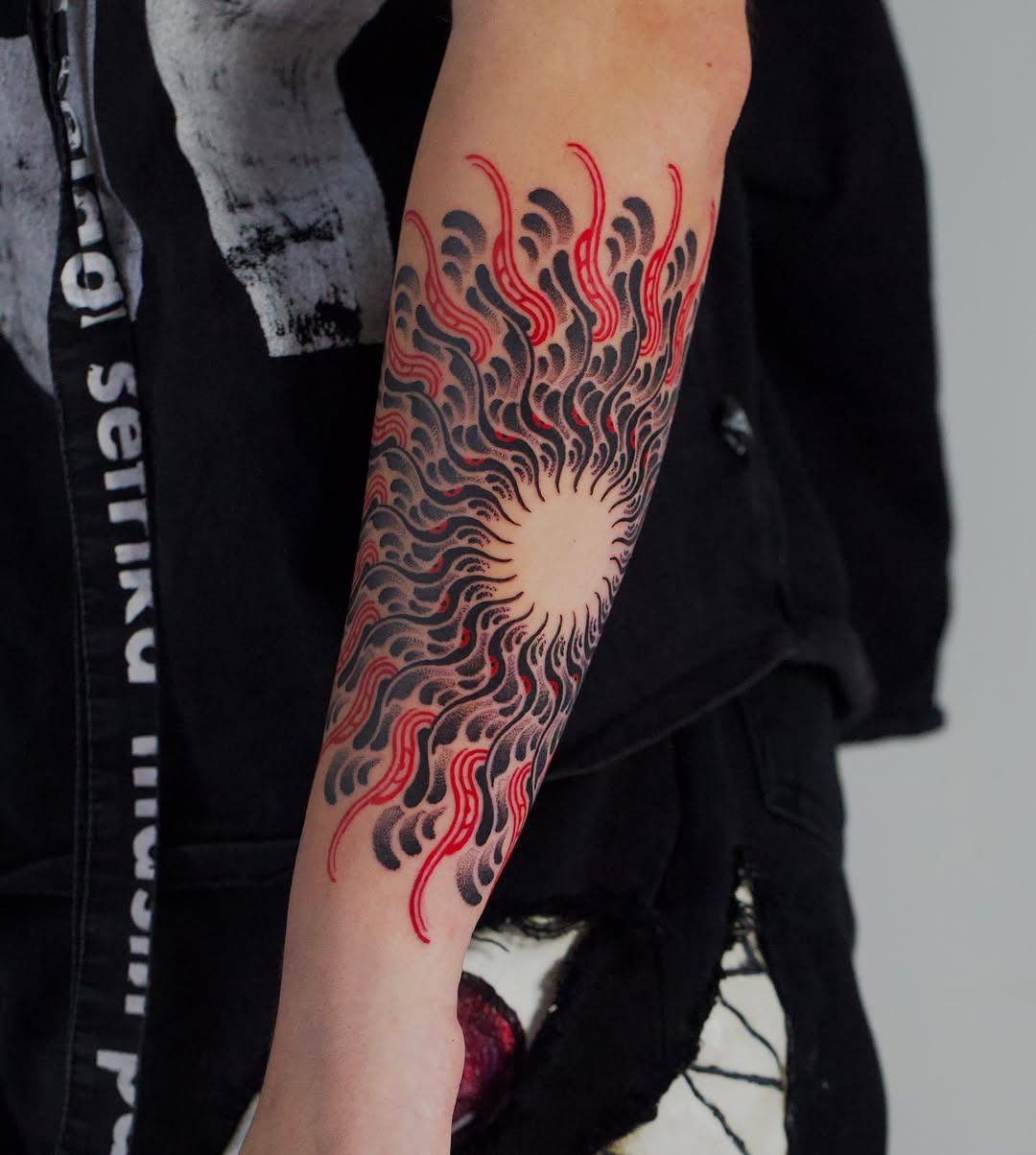 Dynamic sunburst mandala tattoo on forearm Tattoo Design