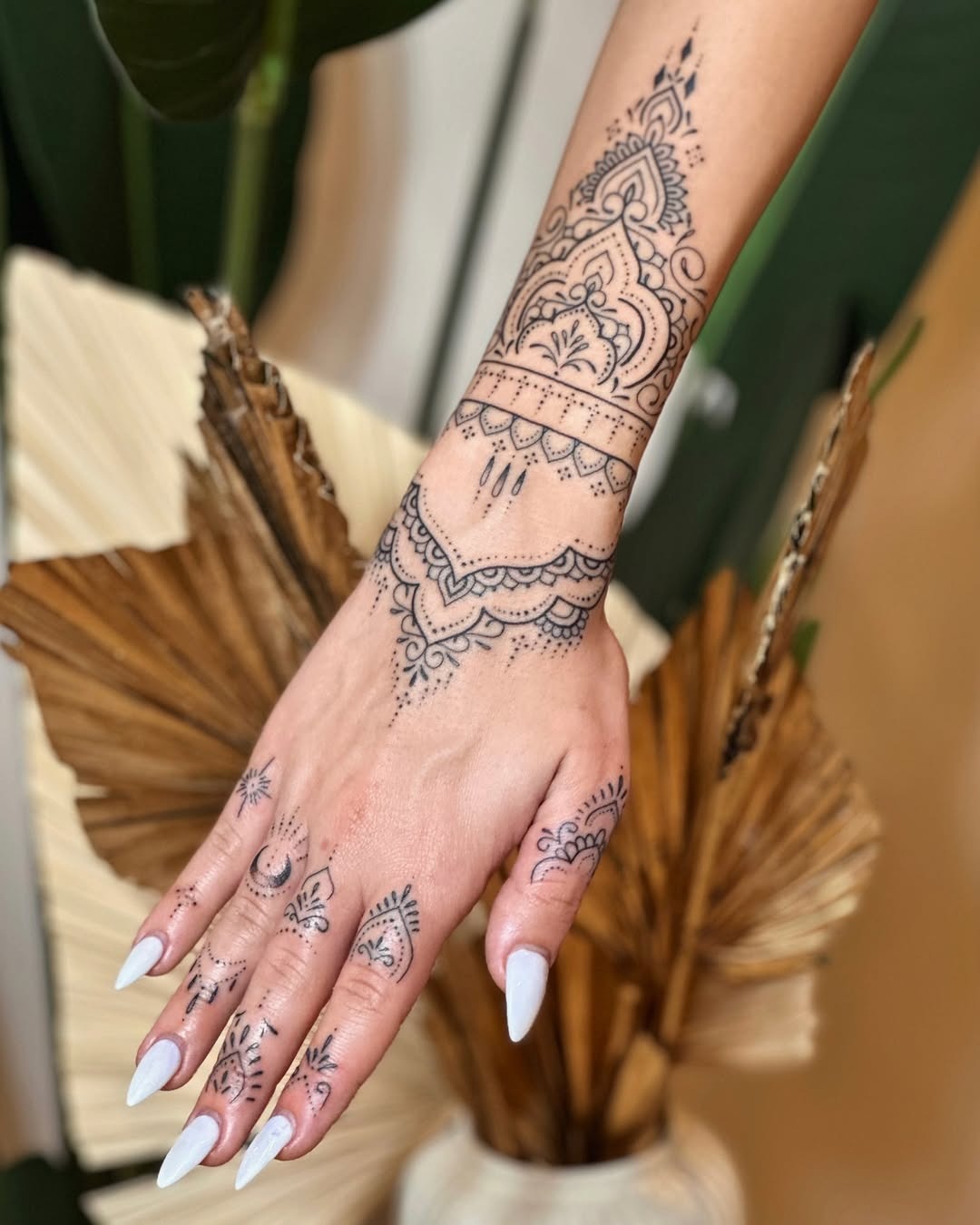Elegant mandala tattoo adorning the hand Tattoo Design
