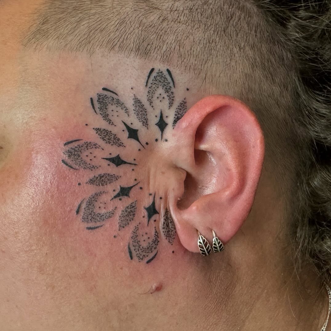 Intricate black mandala design on the head Tattoo Design