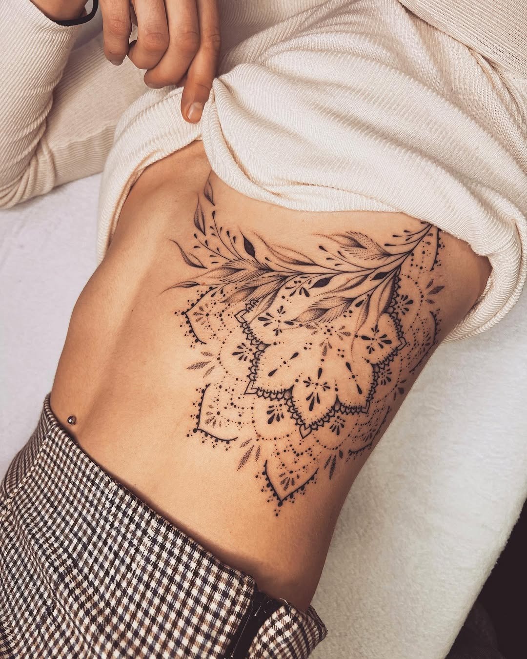 Intricate floral mandala tattoo on side body Tattoo Design