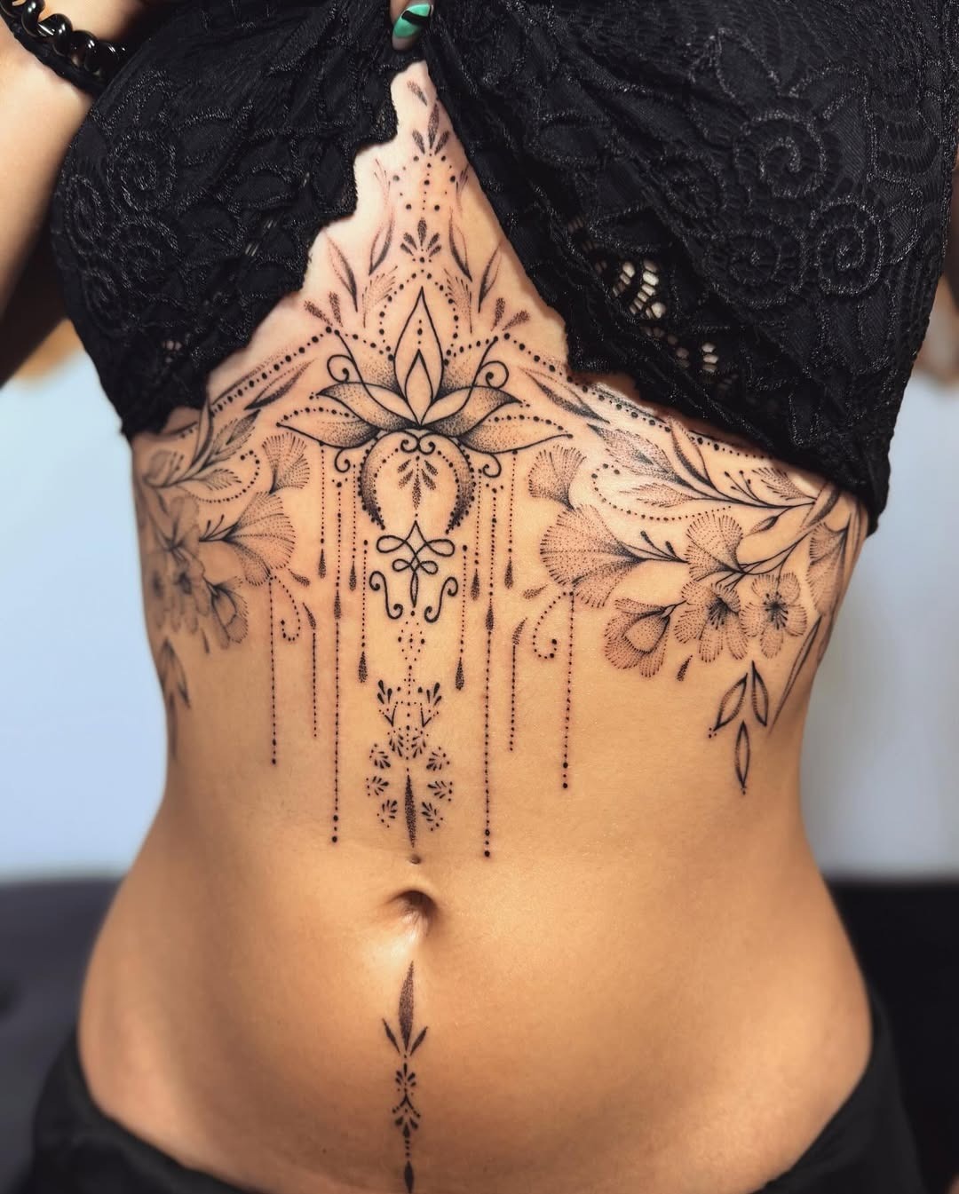 Intricate floral mandala tattoo on the belly Tattoo Design