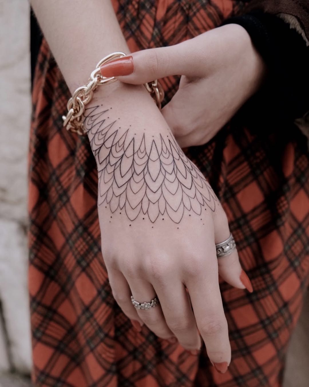 Intricate pattern adorning a stylish hand tattoo Tattoo Design
