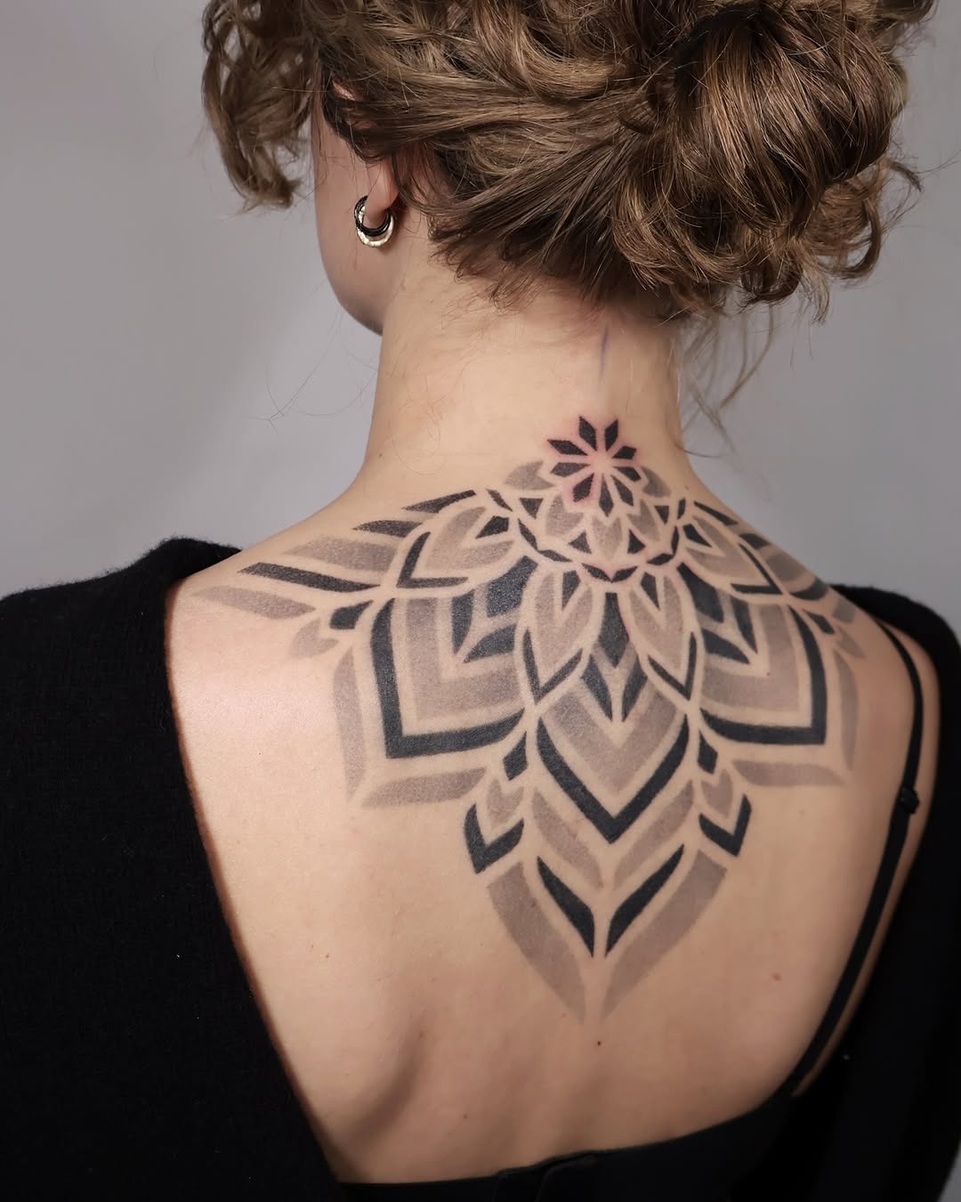 Stunning Mandala Tattoo Gracing the Back Tattoo Design