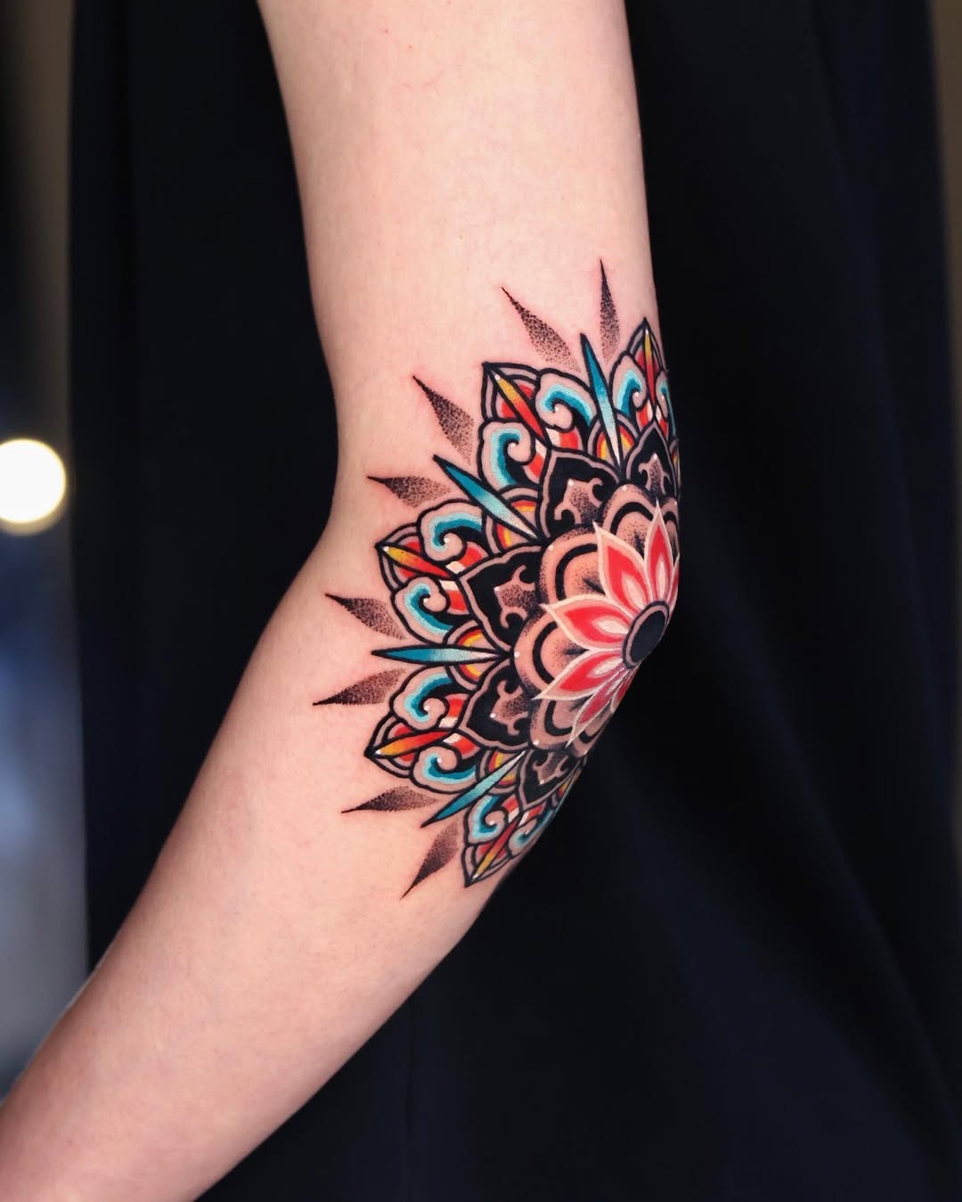 Vibrant mandala elbow tattoo with intricate details Tattoo Design
