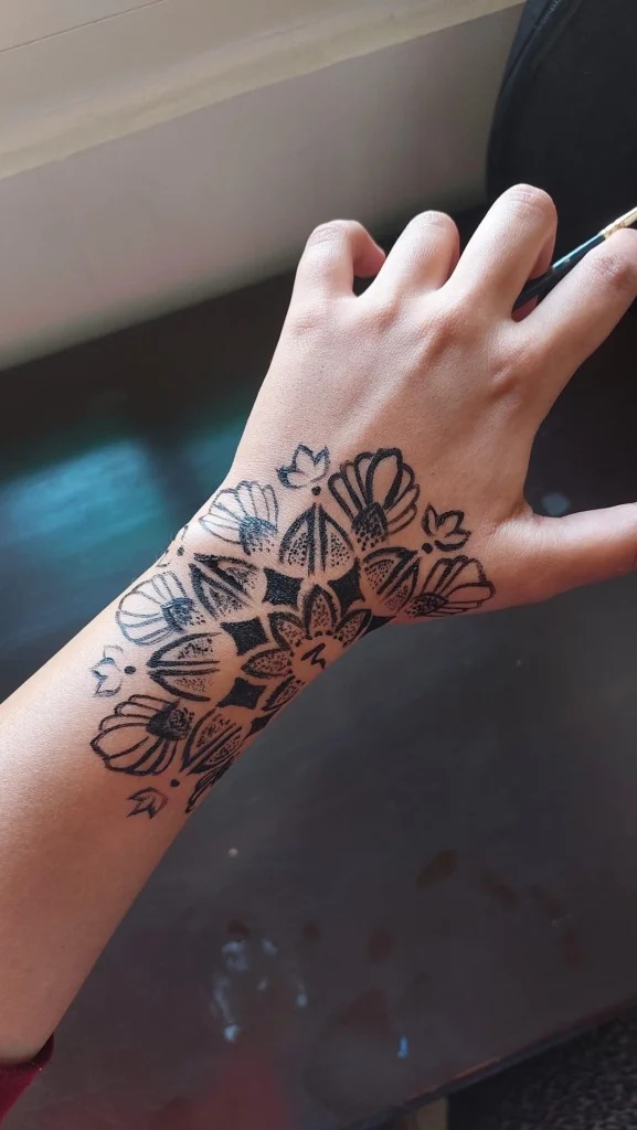 Bold Blackwork Floral Mandala Hand Tattoo Tattoo Design