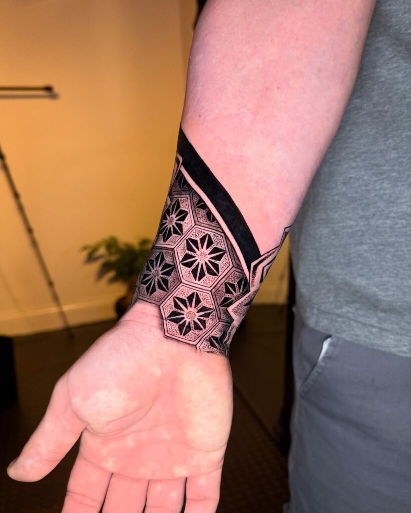 Bold Geometric Mandala Wrist Tattoo with Dot-Work Shading Tattoo Design