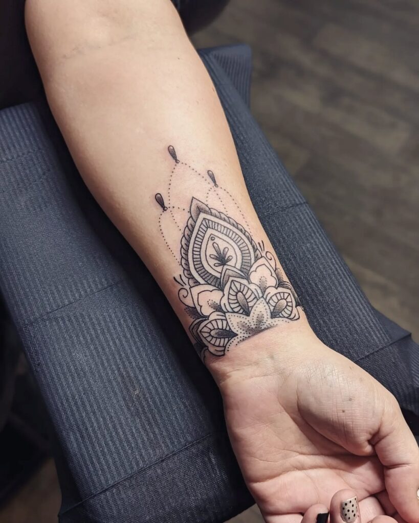 Decorative Mandala Wrist Tattoo with Dotwork Accents Tattoo Design