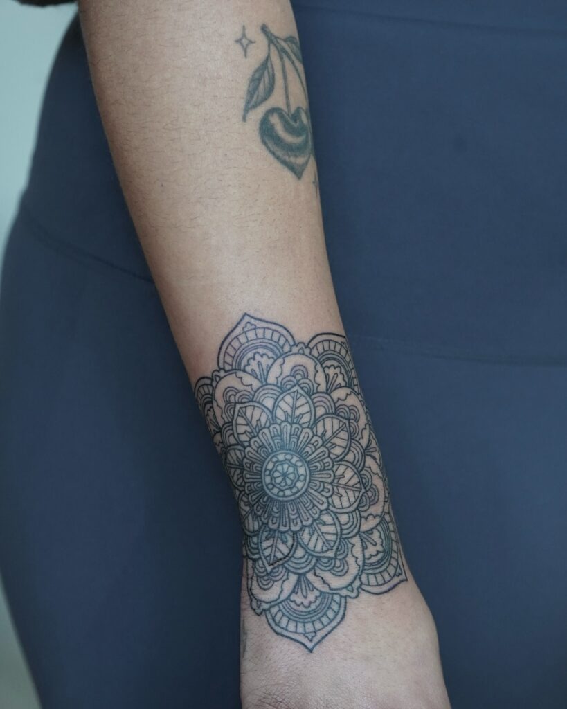 Detailed Mandala Forearm Tattoo with Layered Patterns Tattoo Design