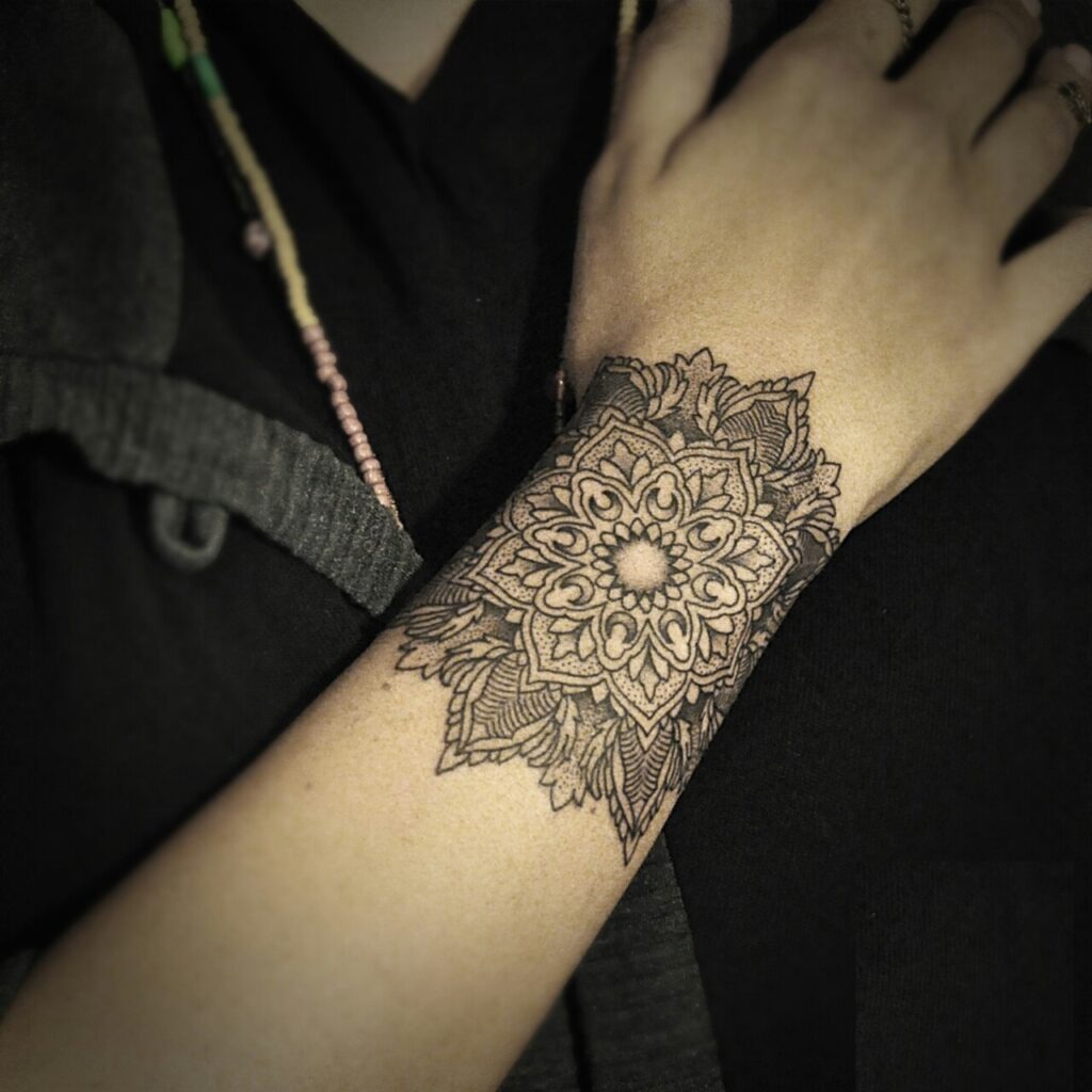 Detailed Mandala Wrist and Hand Tattoo with Leaf Accents Tattoo Design