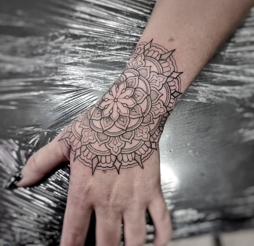 Ornamental Mandala Hand Tattoo with Detailed Petals Tattoo Design