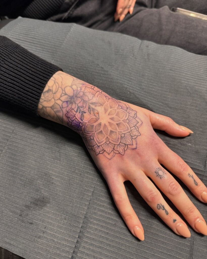 Soft Mandala Hand Tattoo with Fine-Line Detail Tattoo Design