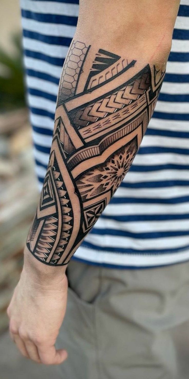 Geometric Forearm Tribal Tattoo with Layered Bands Tattoo Design