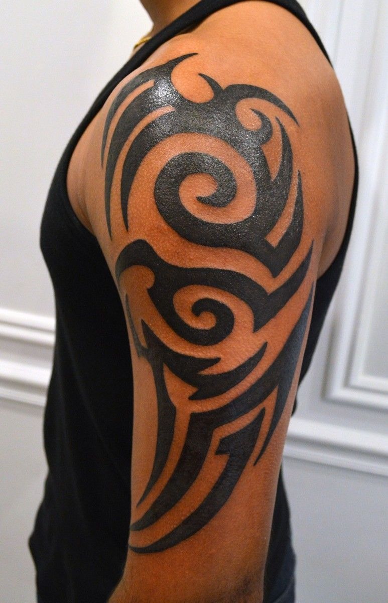 Shoulder Tribal Tattoo with Smooth Spiral Movement Tattoo Design