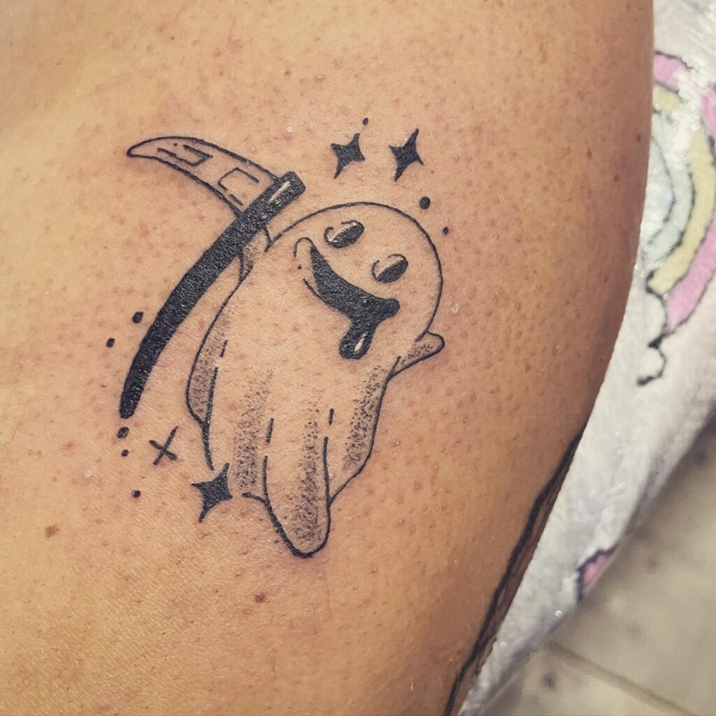Playful Ghost with Scythe Tattoo Tattoo Design