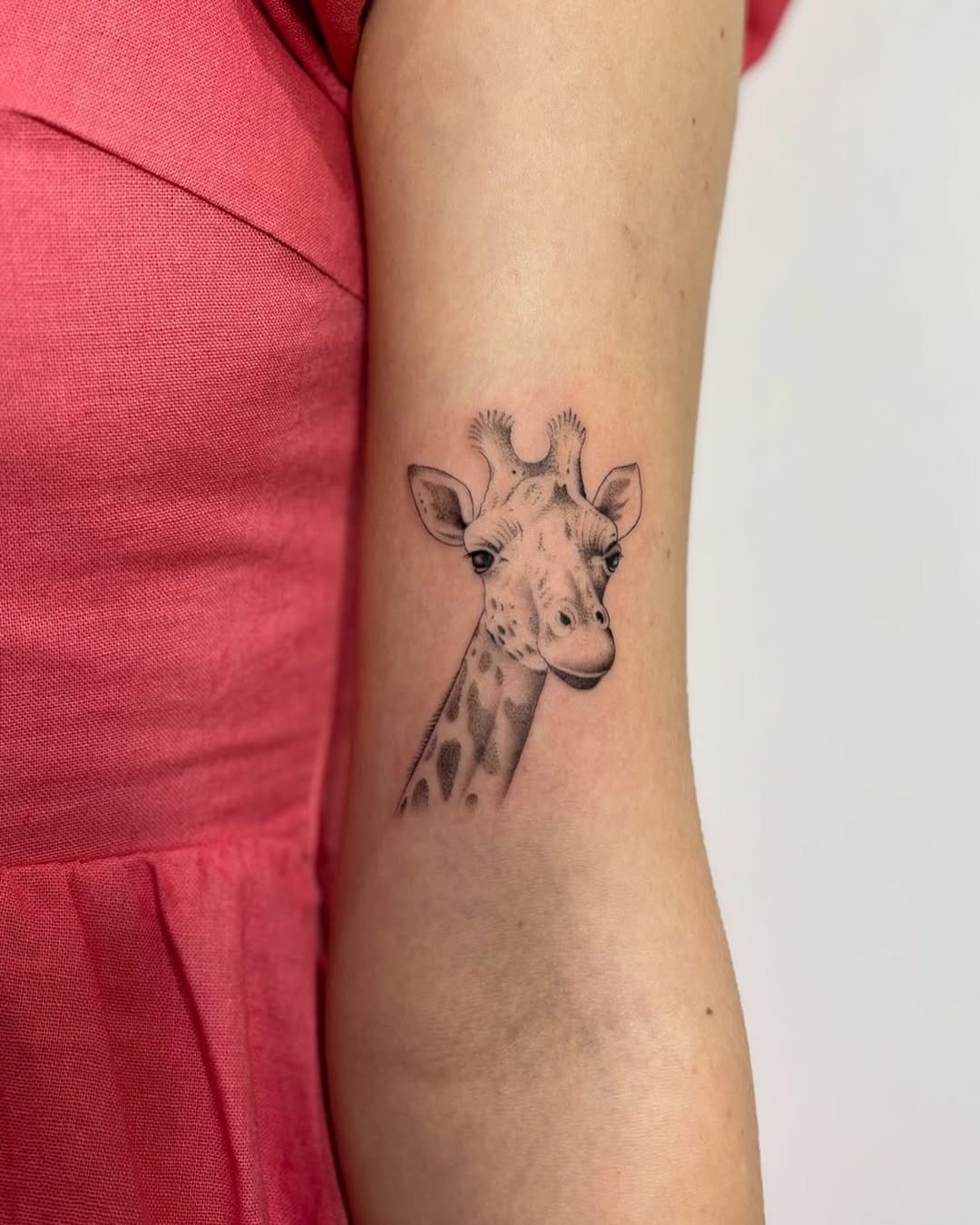 Charming Giraffe Tattoo on Arm for Animal Lovers Tattoo Design