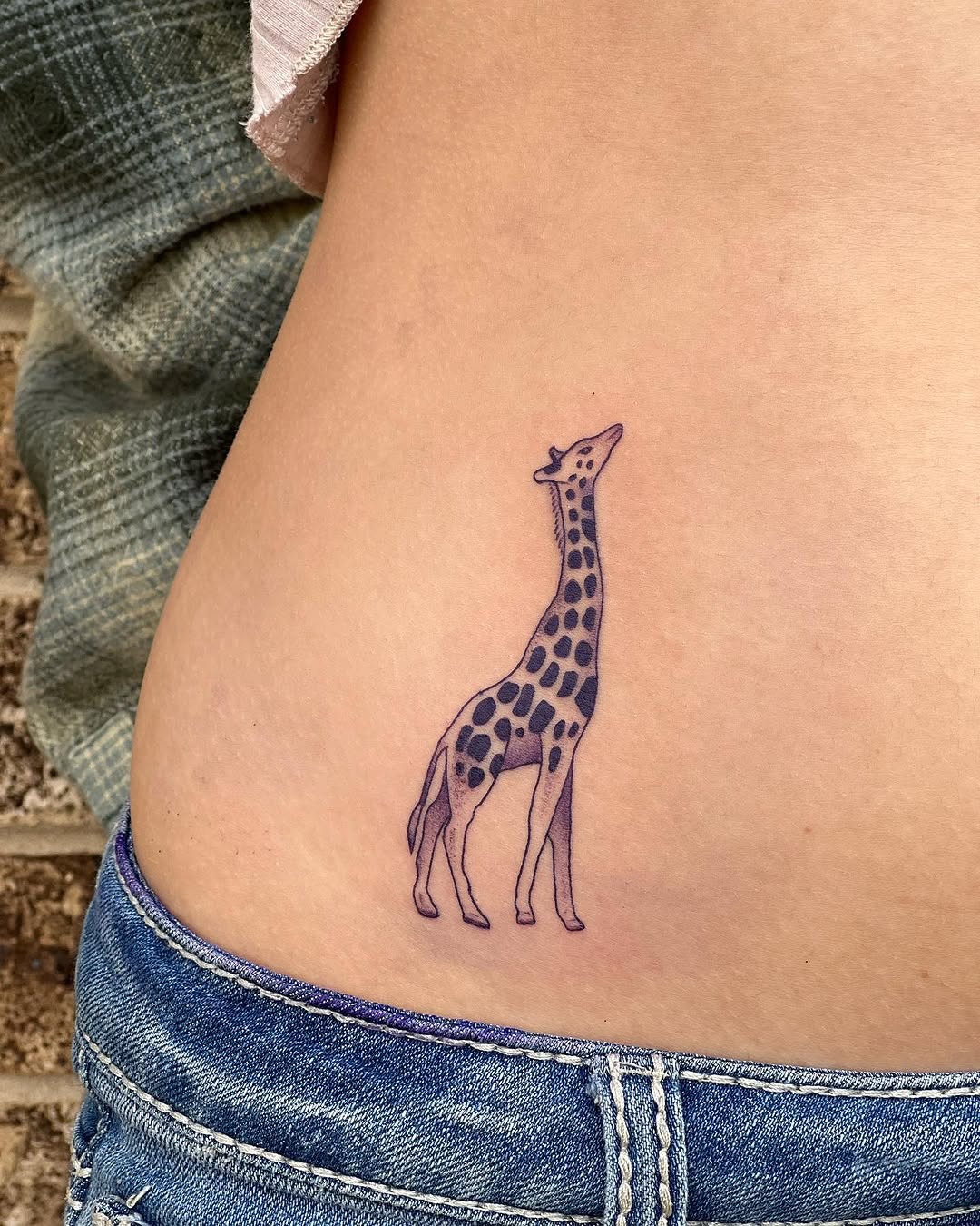 Charming giraffe tattoo on the side body Tattoo Design