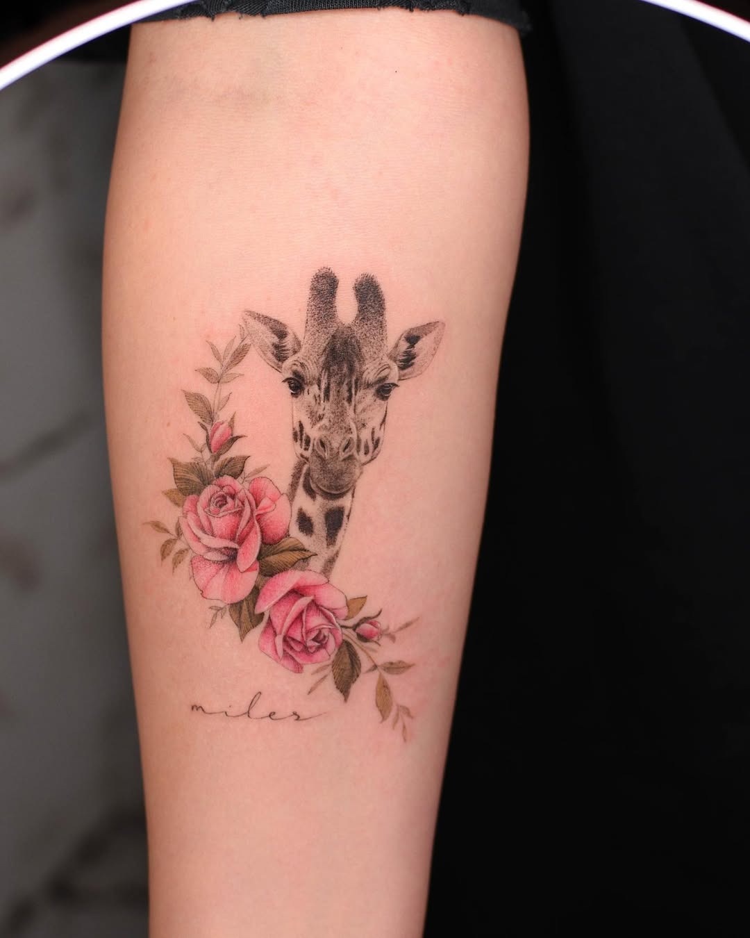 Charming giraffe tattoo with floral accents Tattoo Design
