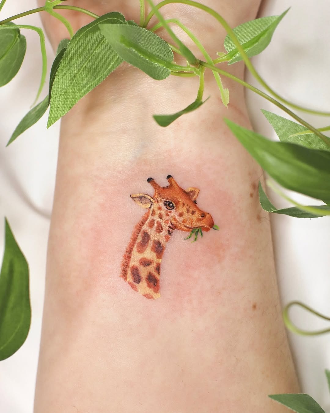 Charming giraffe tattoo with vibrant details Tattoo Design