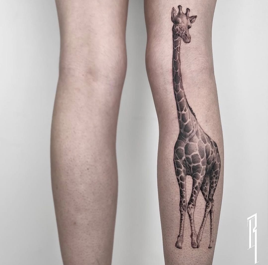 Elegant giraffe tattoo on calf showcases artistry Tattoo Design