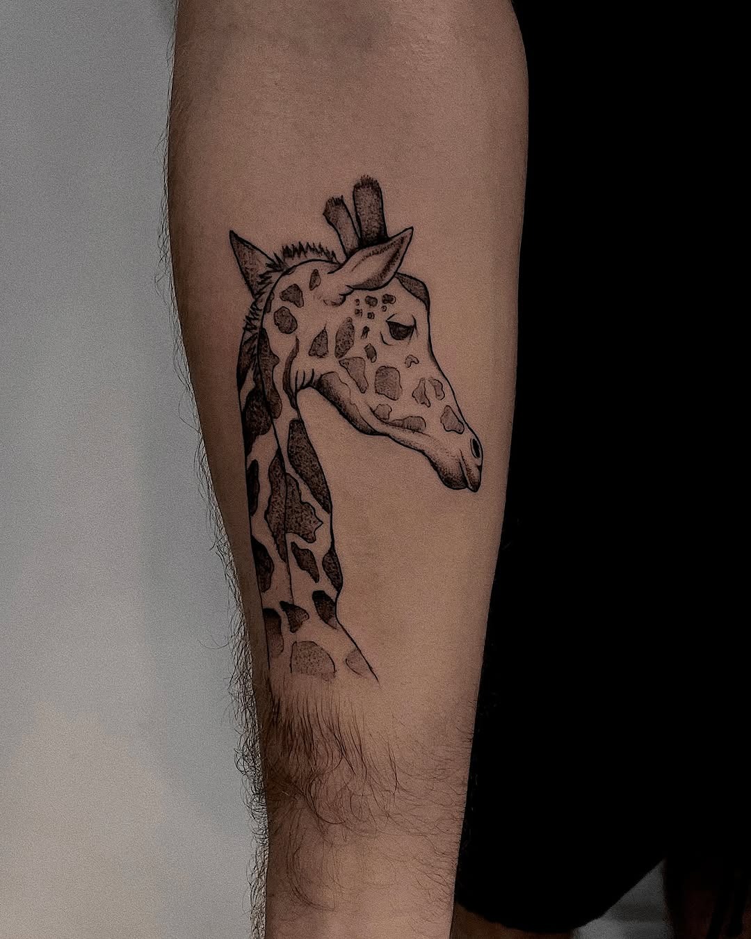 Stunning giraffe head tattoo in black ink Tattoo Design