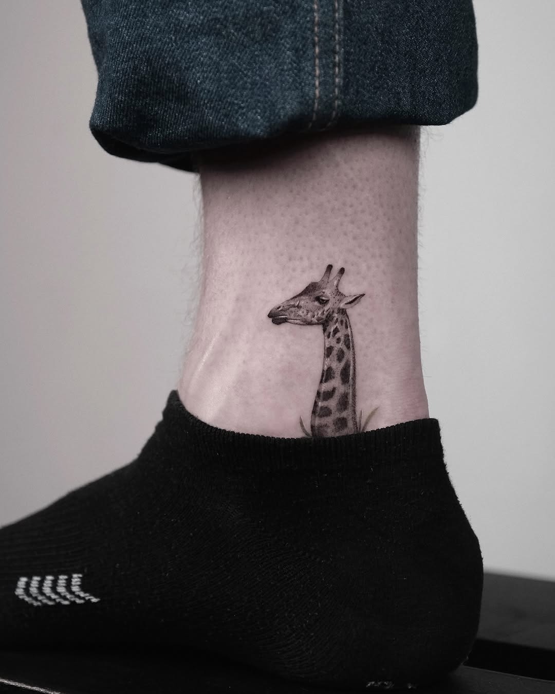 Unique giraffe tattoo on ankle Tattoo Design