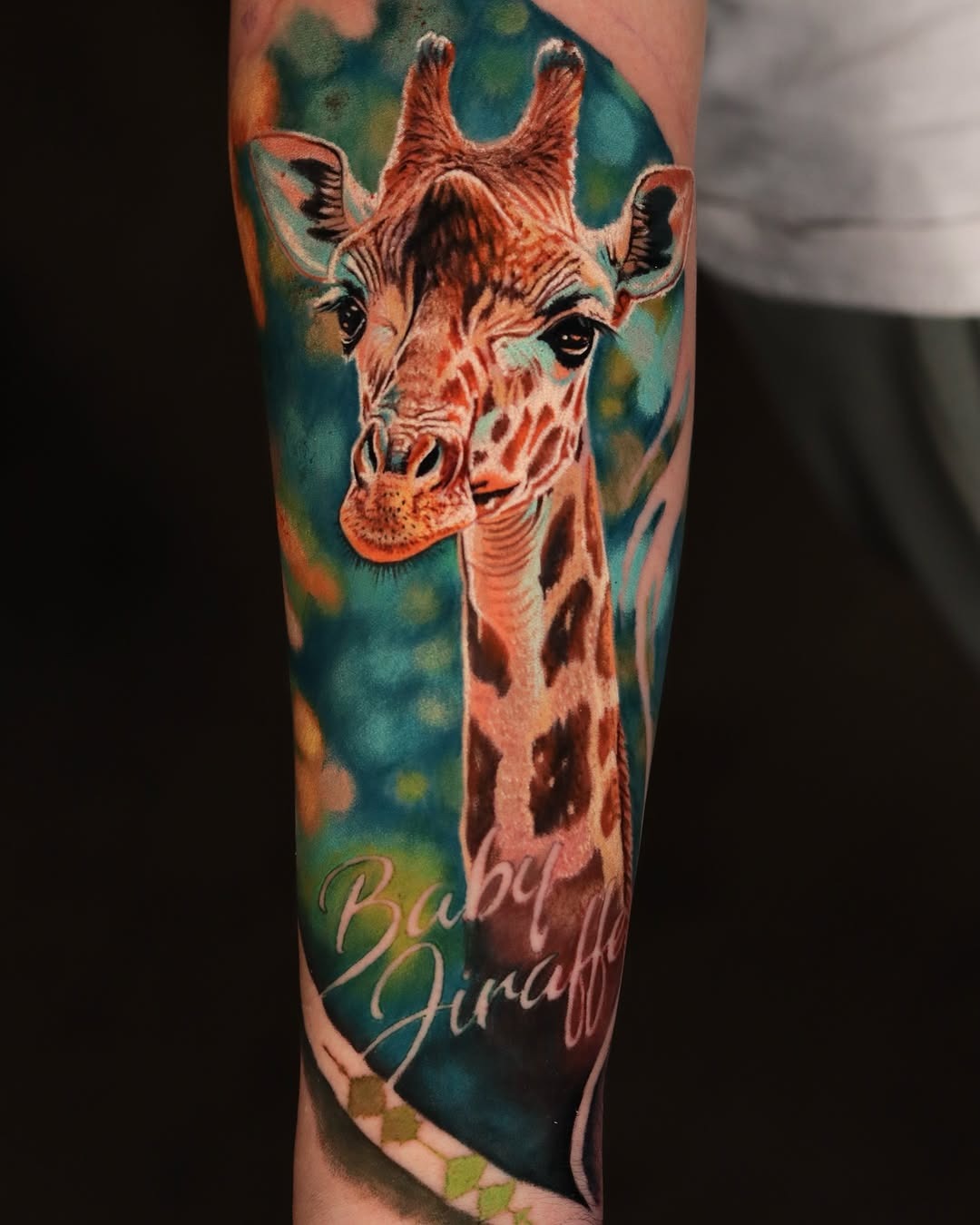 Whimsical baby giraffe tattoo with vibrant colors Tattoo Design