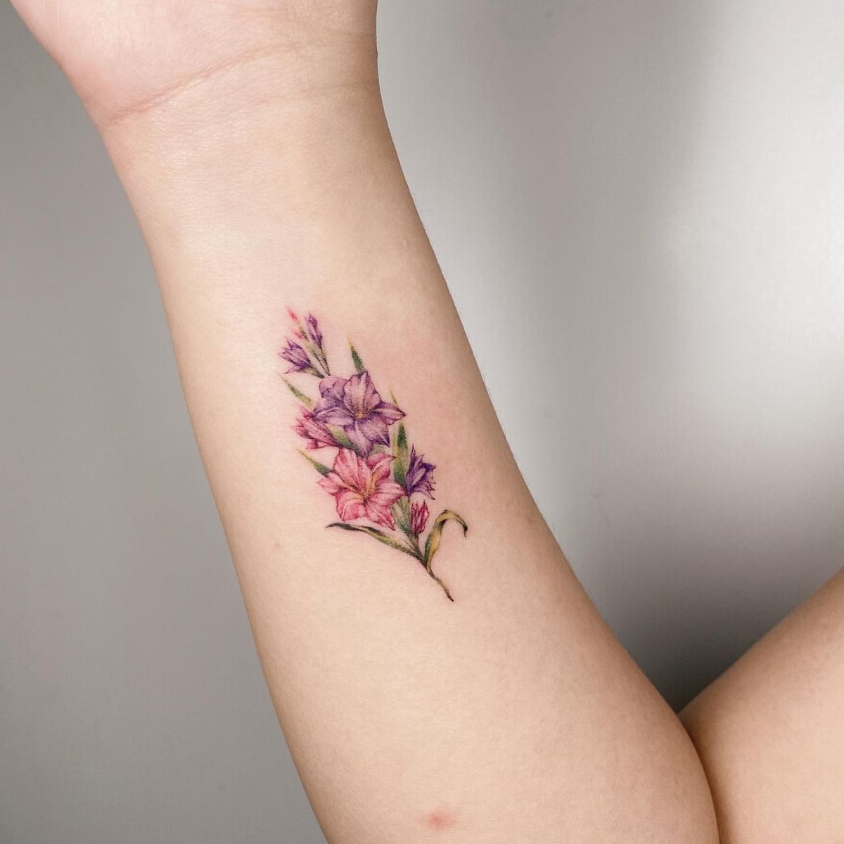 Bold Black Gladiolus Sleeve Accent Tattoo Design