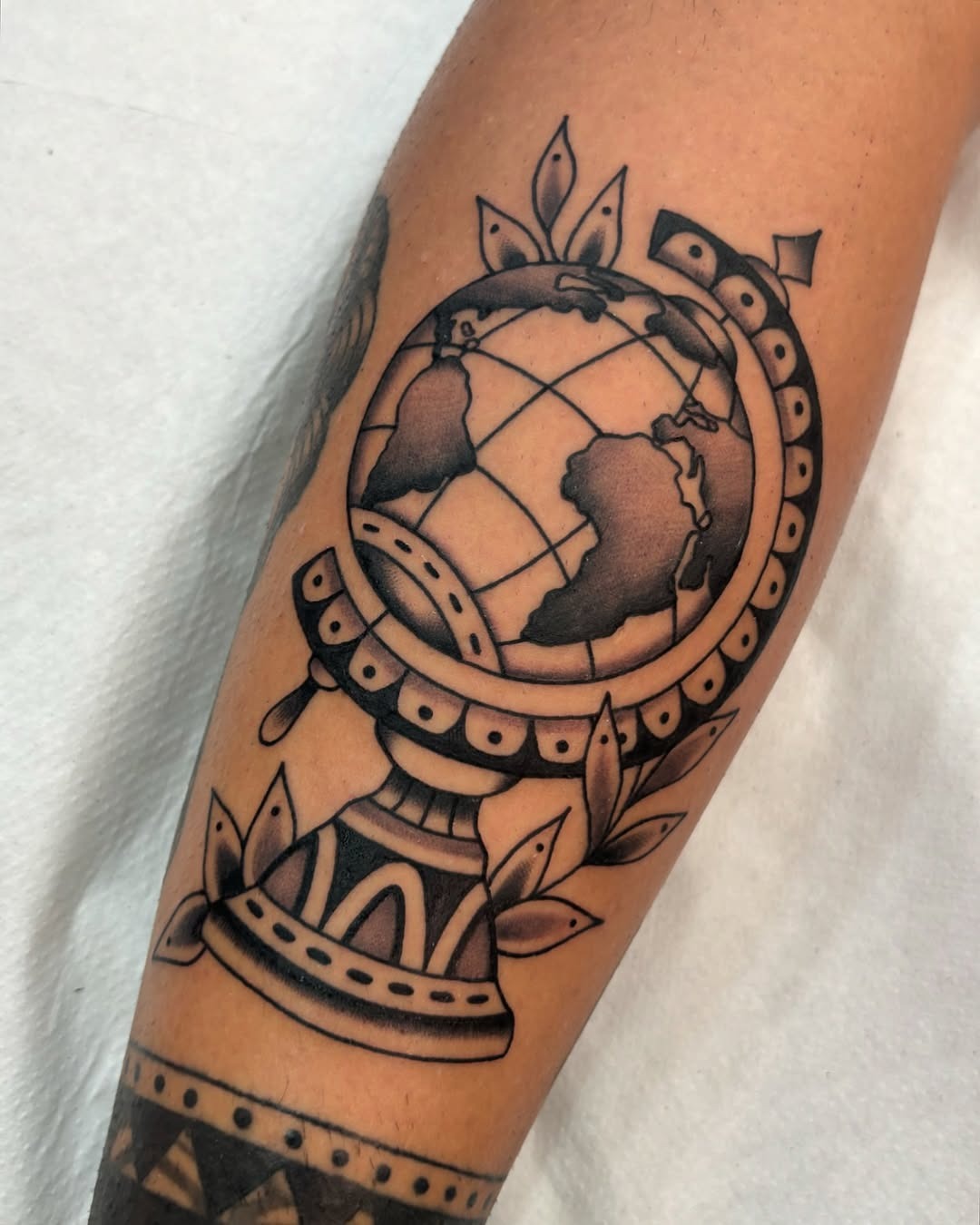 Artistic Globe Tattoo on Forearm Tattoo Design