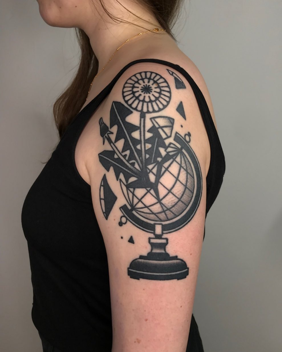 Artistic Globe Tattoo with Geometric Elements Tattoo Design