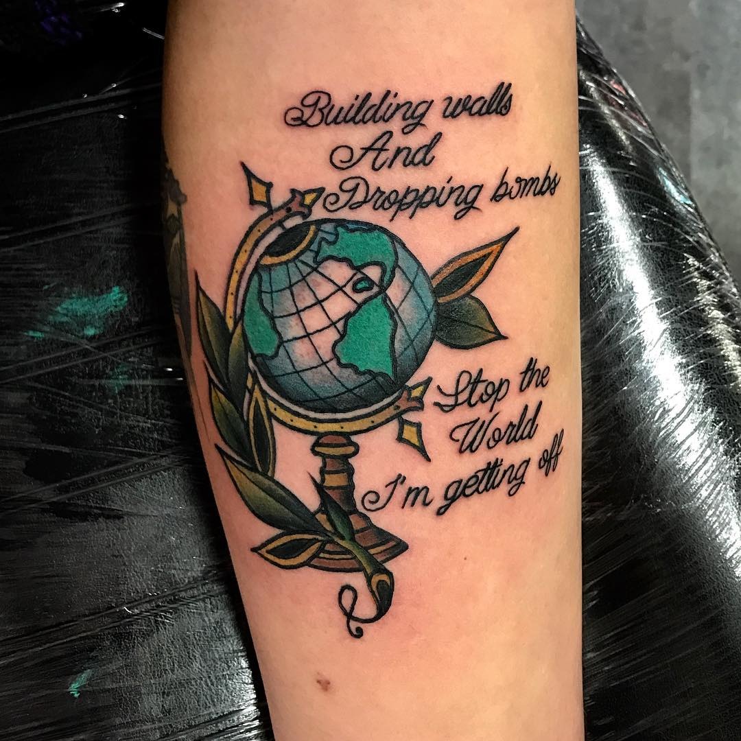 Creative globe tattoo with impactful lyrics Tattoo Design