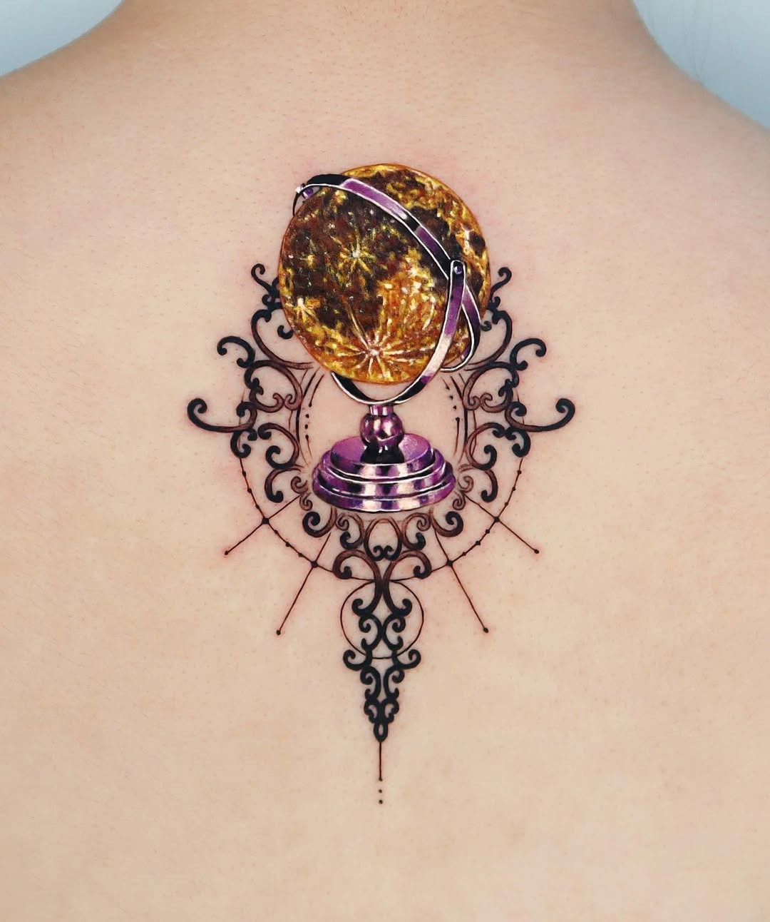 Elegant globe tattoo with intricate design elements Tattoo Design