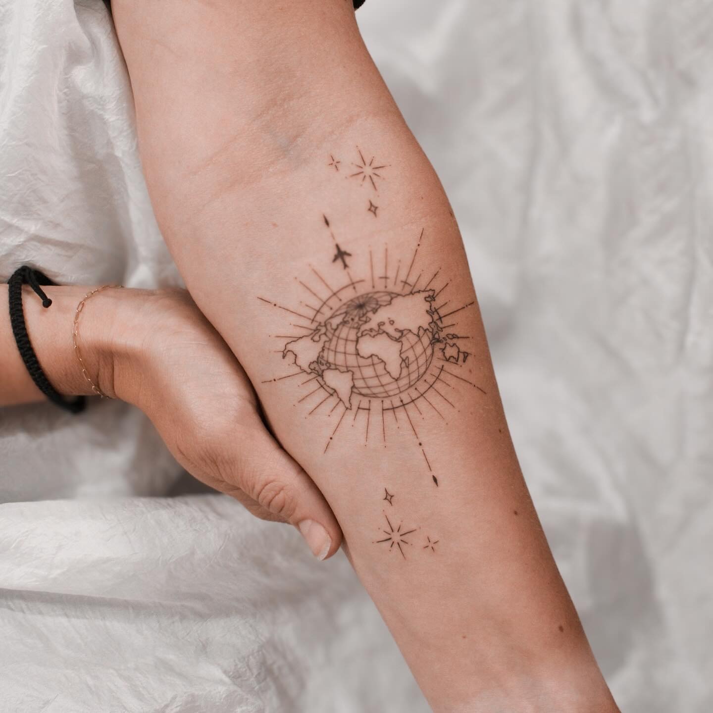 Intricate globe tattoo with star accents Tattoo Design