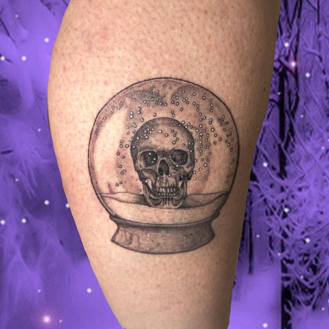 Intricate skull within a mesmerizing globe tattoo Tattoo Design