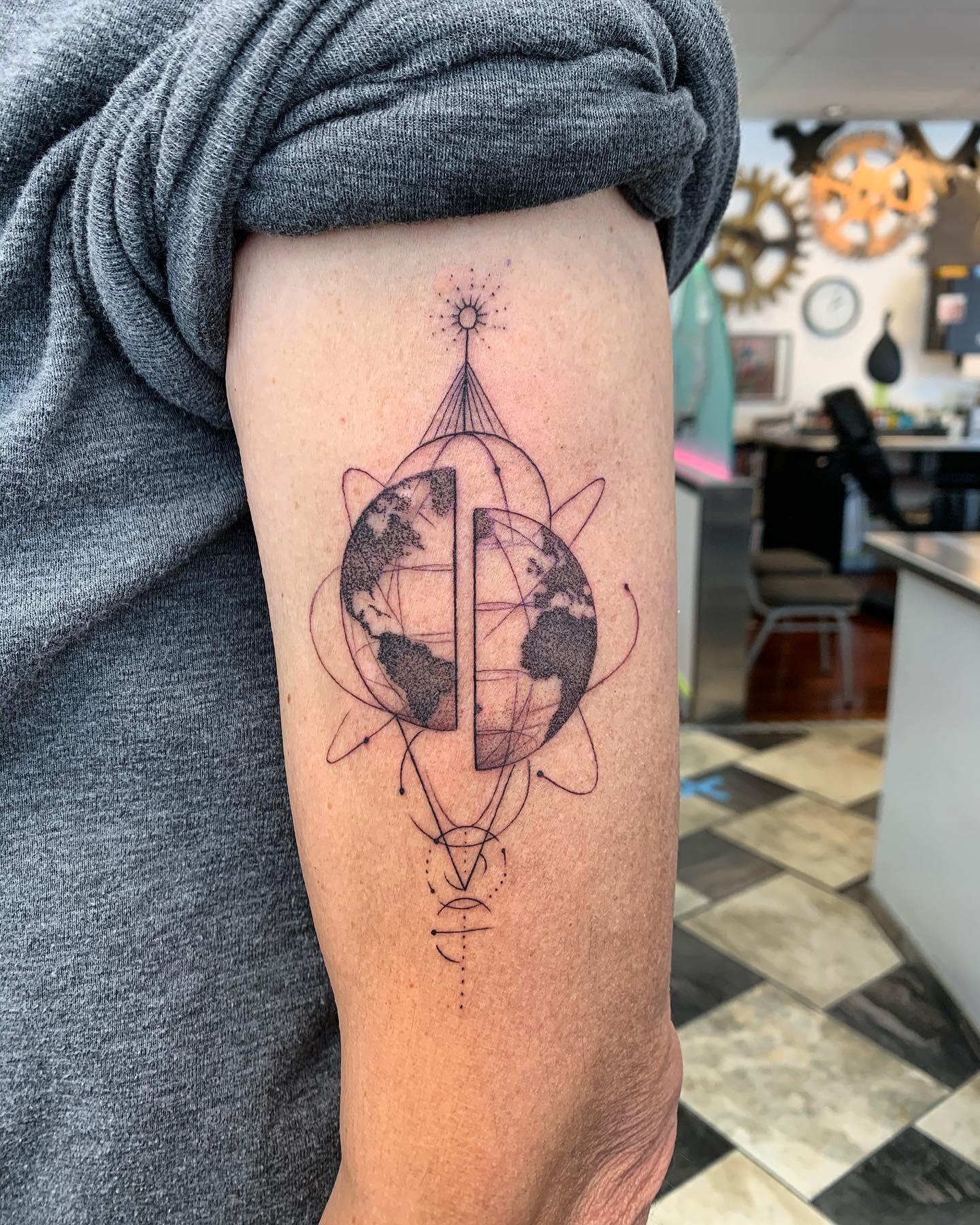 Stunning geometric globe tattoo design Tattoo Design