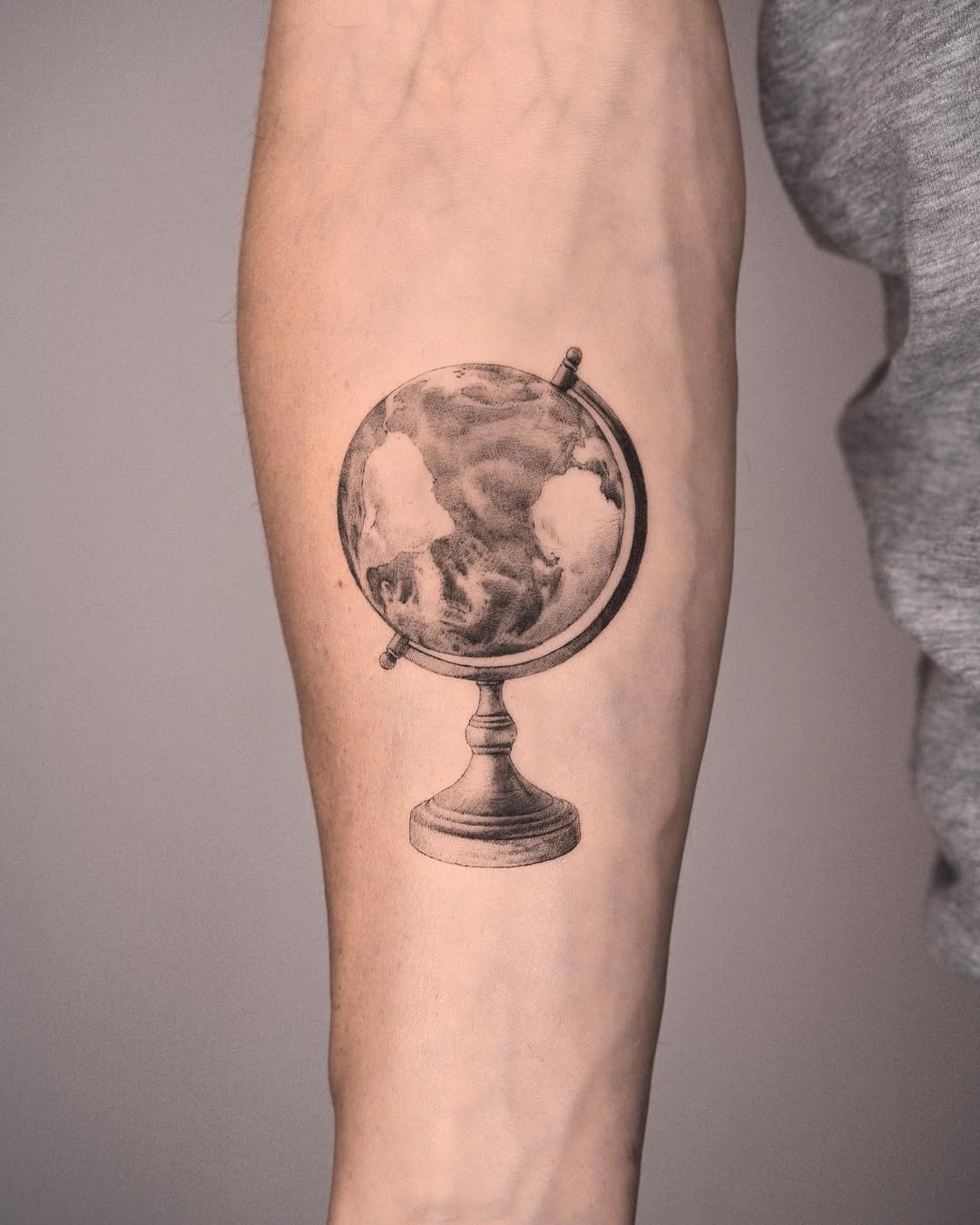Stunning Globe Tattoo on Forearm Tattoo Design
