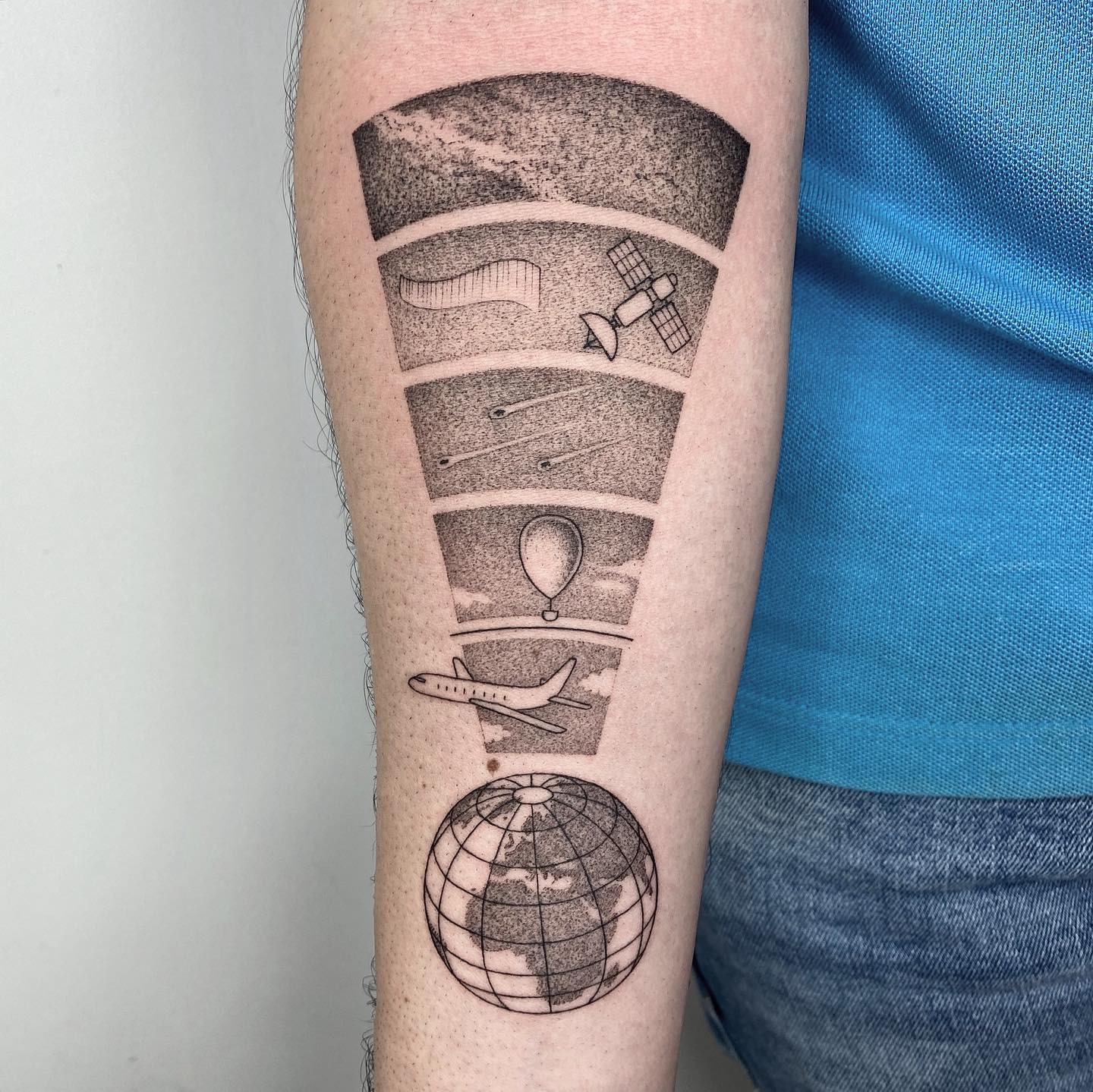 Unique globe tattoo showcasing space exploration themes Tattoo Design